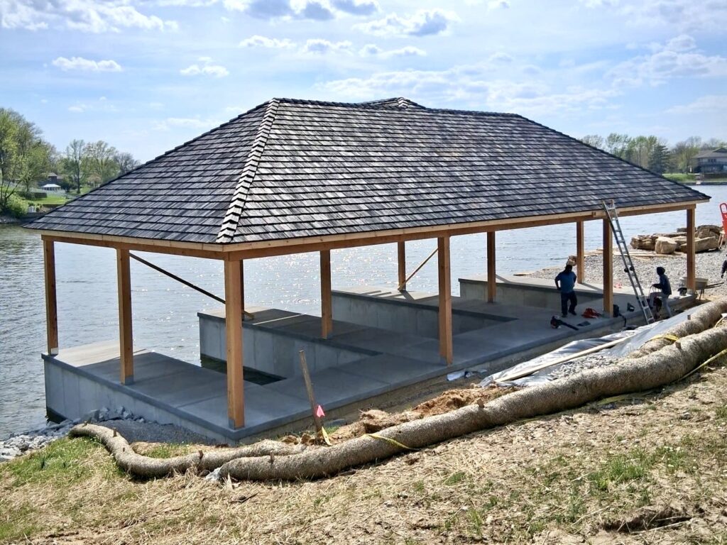 New hip roof asphalt shingle installation on a waterfront pavilion near Worden IL completed by Barringer Brothers Roofing