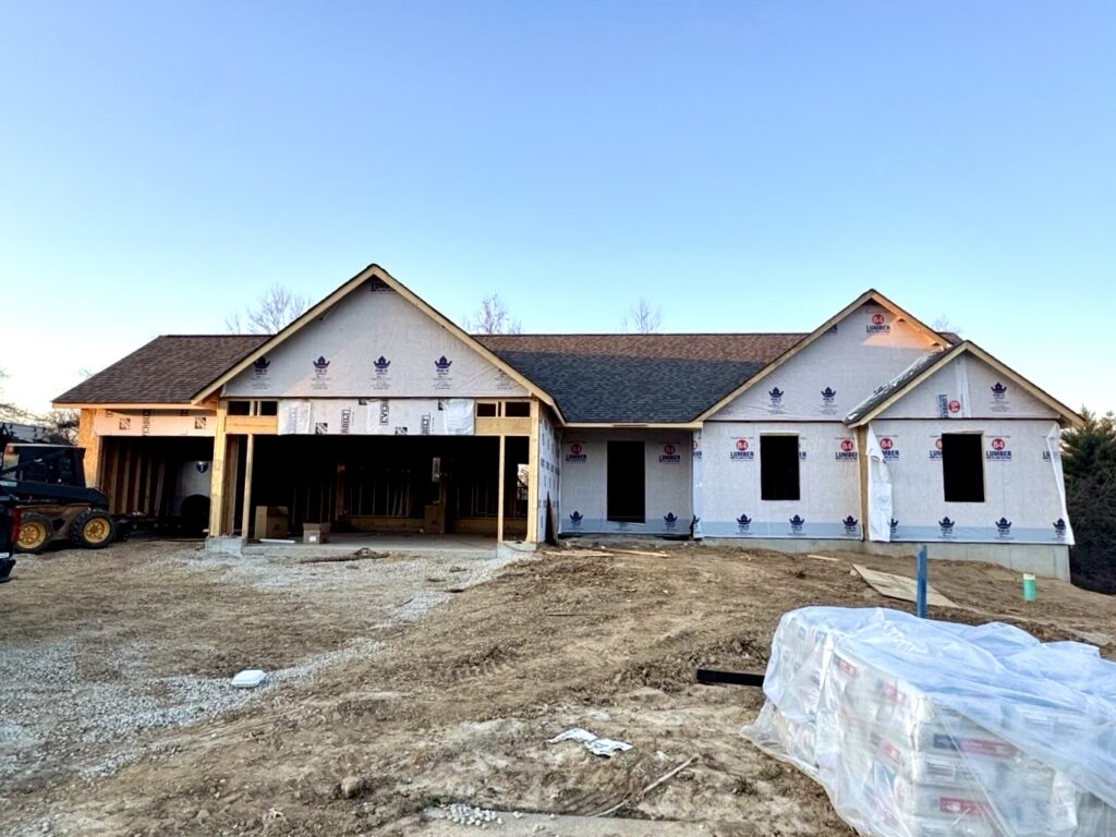 new construction roofing stage showing architectural shingles installed over synthetic underlayment southern illinois subdivision home build