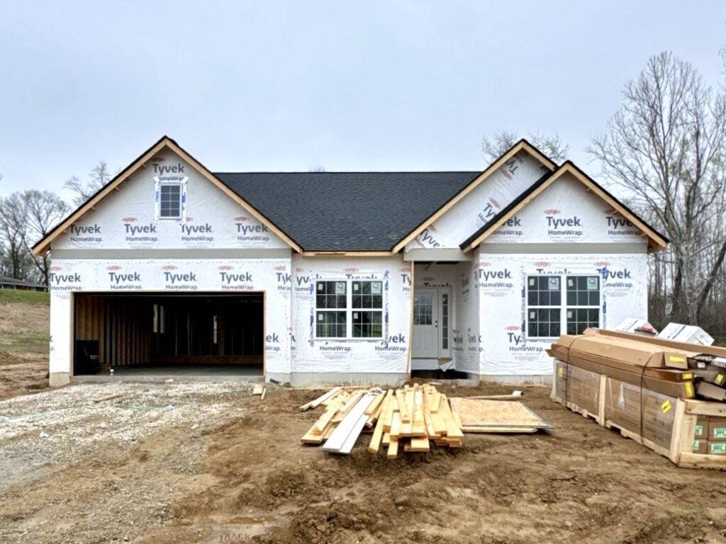 storm-ready new construction roofing Wood River IL architectural shingles installed before siding during Midwest home construction