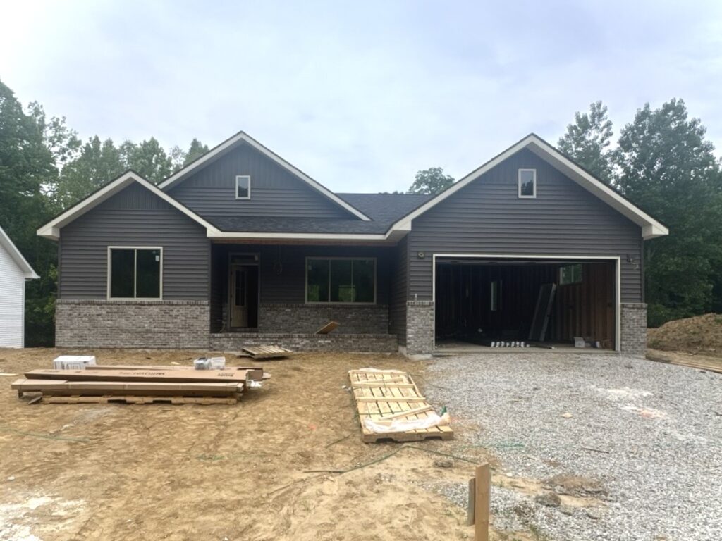 New construction home with dark gray siding installation in Caseyville Illinois