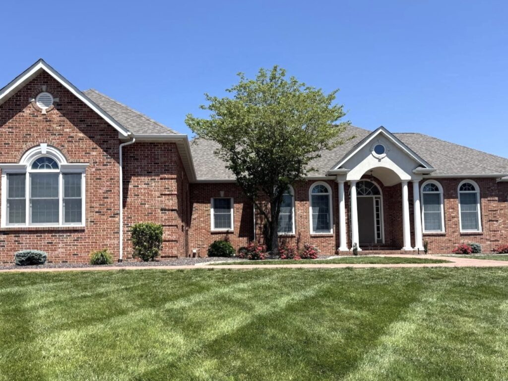 Large brick home with architectural shingle roof installed in O’Fallon IL