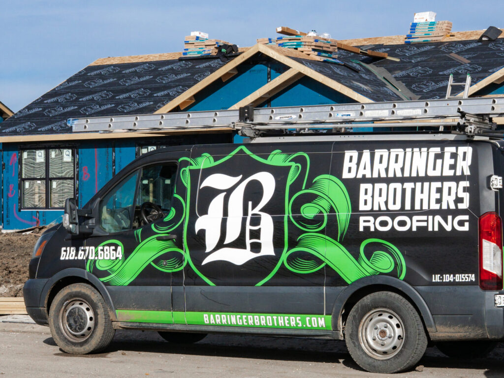 Barringer Brothers Roofing crew installing roof