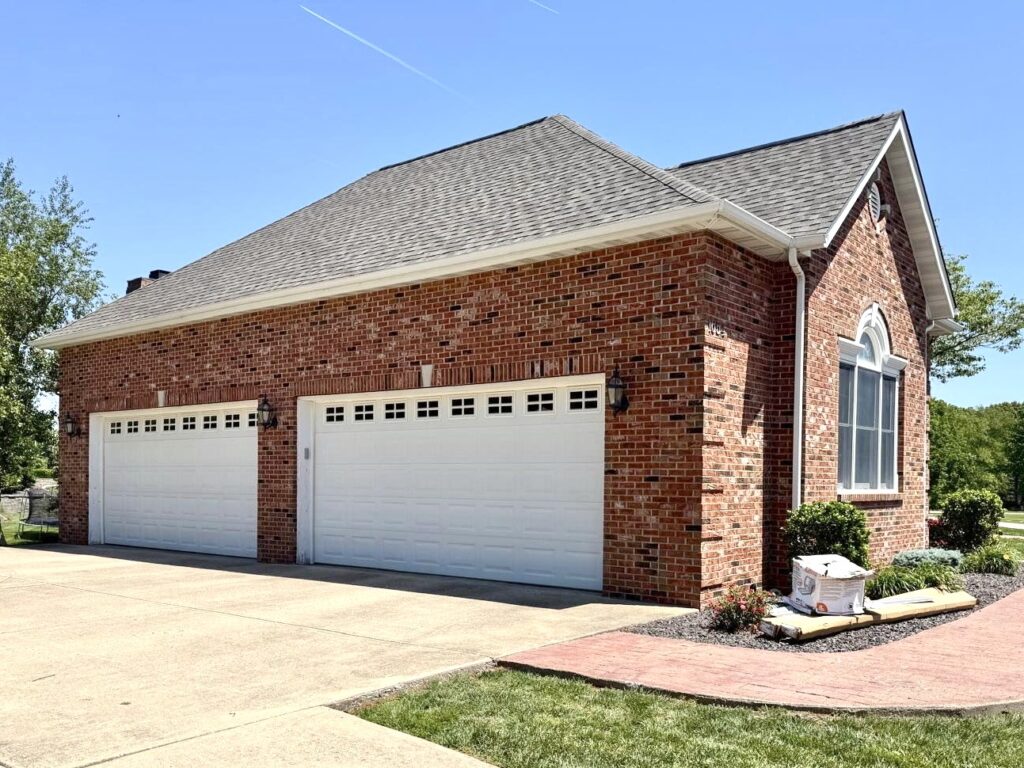 Architectural shingle roof on brick home in O'Fallon IL installed by Barringer Brothers Roofing