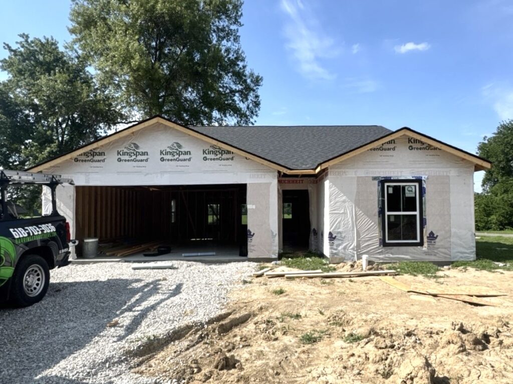 New construction home with architectural asphalt shingle roof installation in O'Fallon IL by Barringer Brothers Roofing