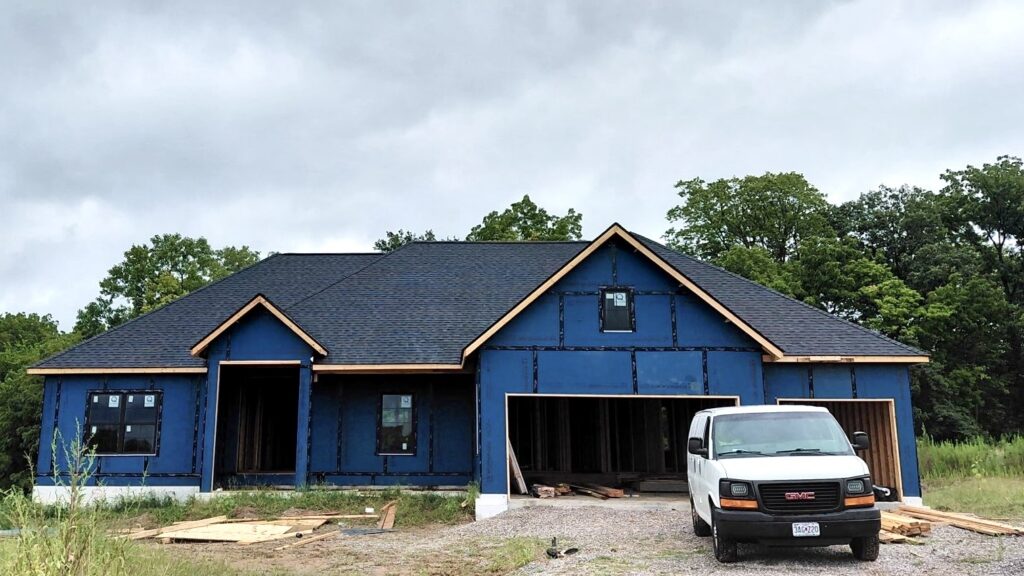 Professional asphalt roof installation on a new home in Columbia, IL by Barringer Brothers Roofing.