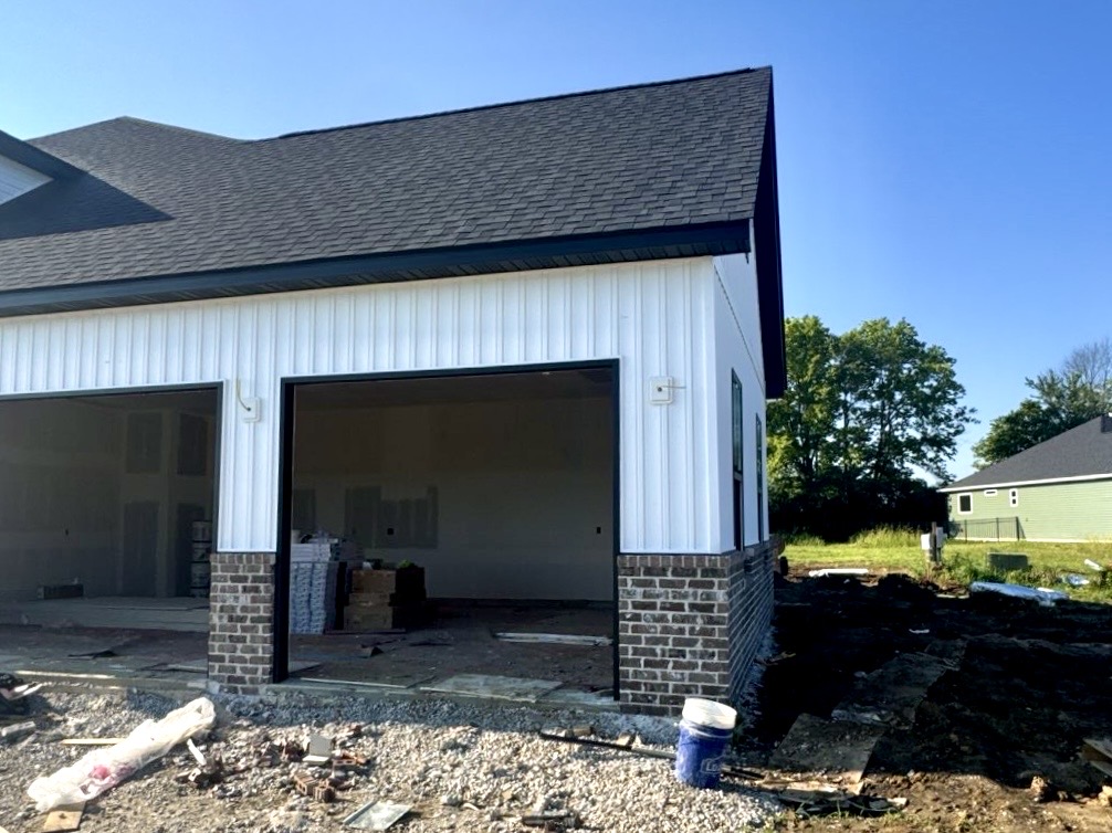 New white vinyl siding installation on a home in Glen Carbon, IL by Barringer Brothers Roofing.