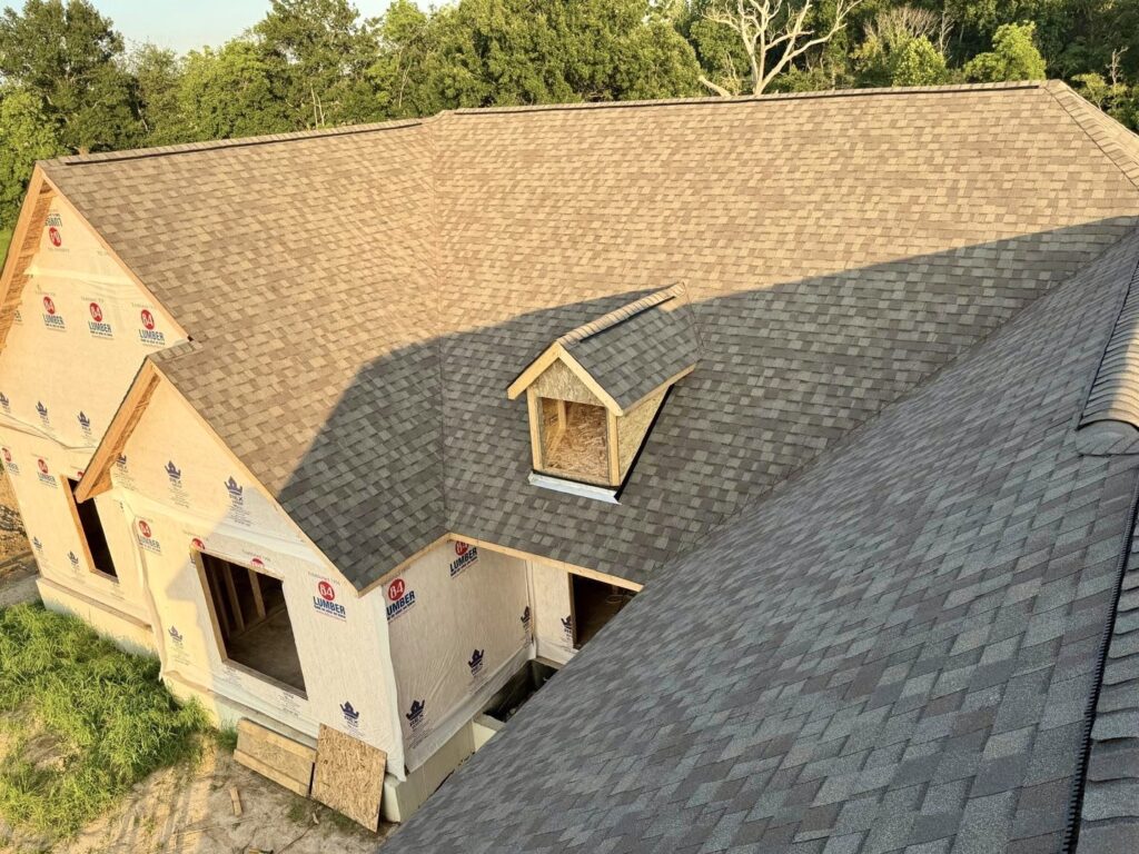 New architectural asphalt roof installed by Barringer Brothers Roofing on a home in O'Fallon, IL.