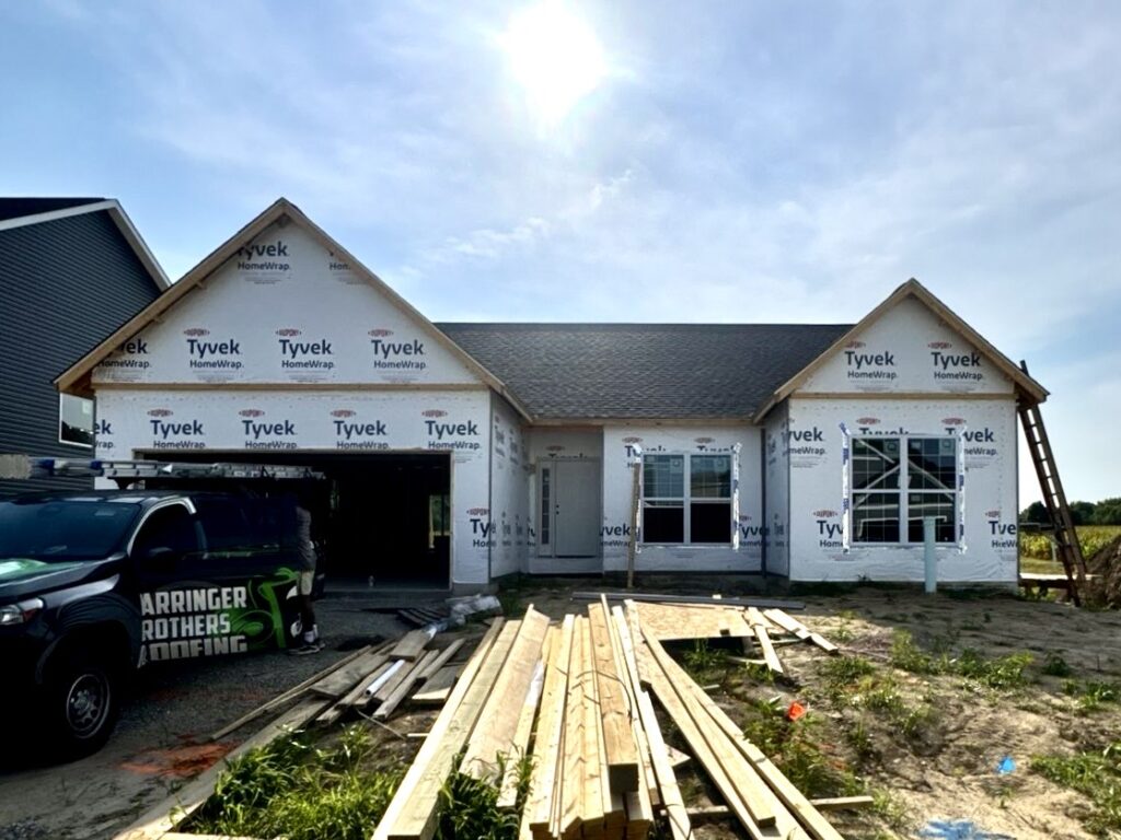 New construction home with asphalt roof installed by Barringer Brothers Roofing in O'Fallon, IL.