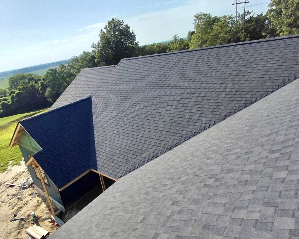 Completed asphalt roof replacement by Barringer Brothers Roofing.