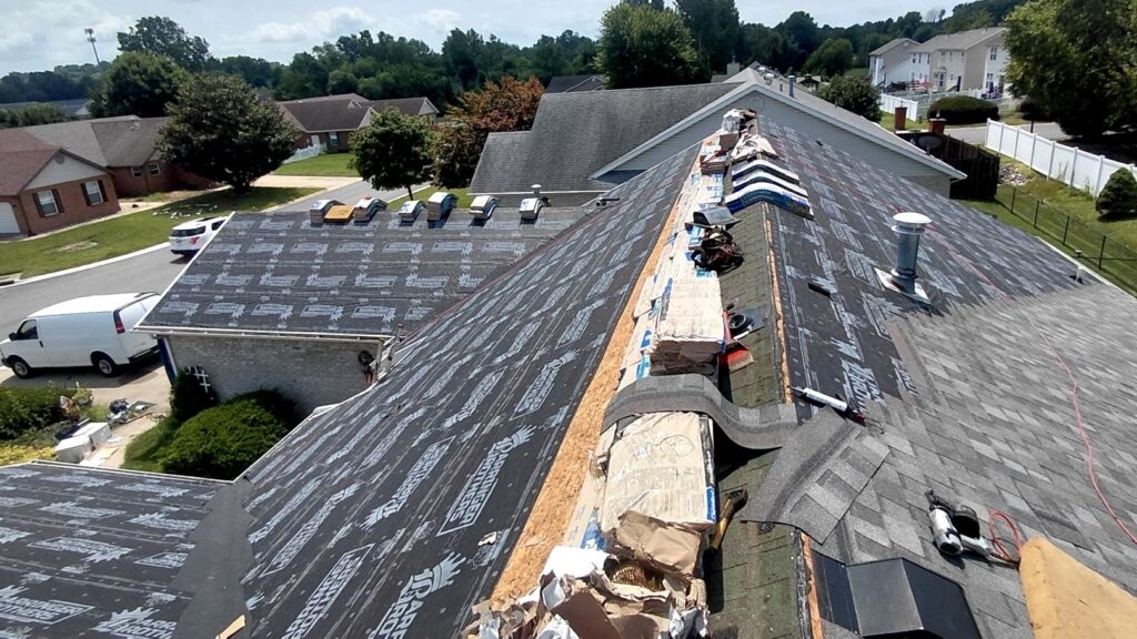 Old shingles removed during an asphalt roof replacement by Barringer Brothers Roofing.