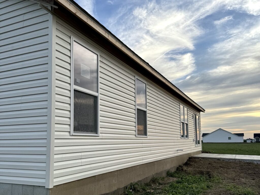 Vinyl siding installation completed by Barringer Brothers Roofing on an Illinois home serving the Metro East area.