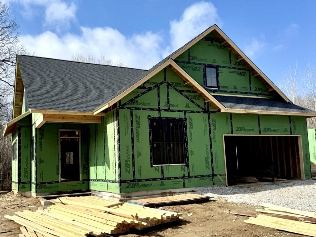 New construction home with completed asphalt shingle roof in Caseyville, IL by Barringer Brothers Roofing.