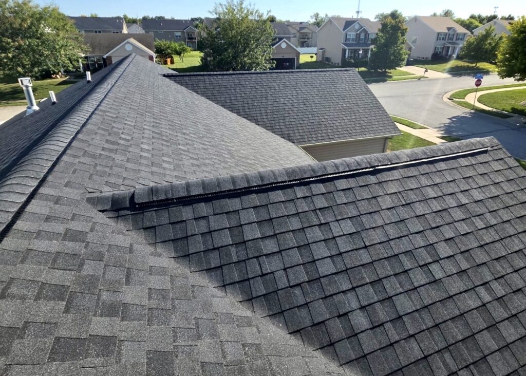 Ridge vent installed along the peak of an asphalt shingle roof by Barringer Brothers Roofing.