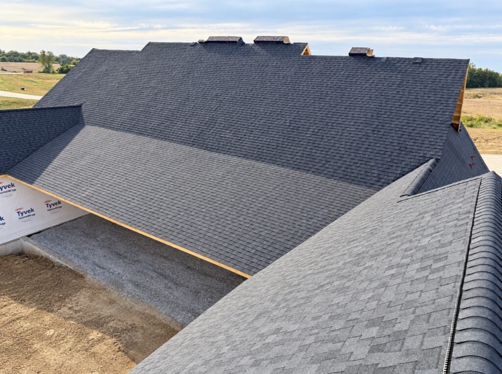 New construction asphalt shingle roof installed by Barringer Brothers Roofing on a home in Columbia, IL.