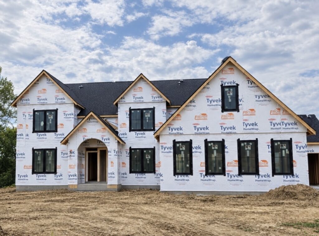 New construction home with black asphalt shingle roofing installed by Barringer Brothers Roofing in Shiloh, Illinois.