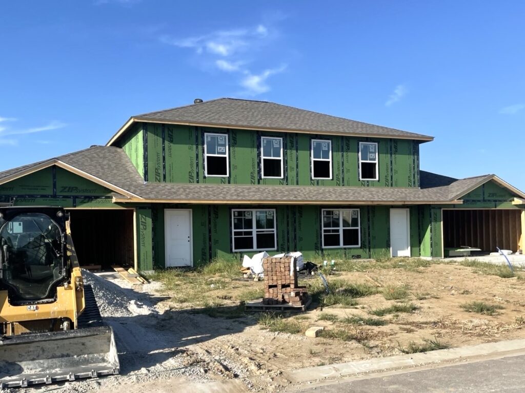 New construction asphalt shingle roof on a home in Troy, IL installed by Barringer Brothers Roofing.